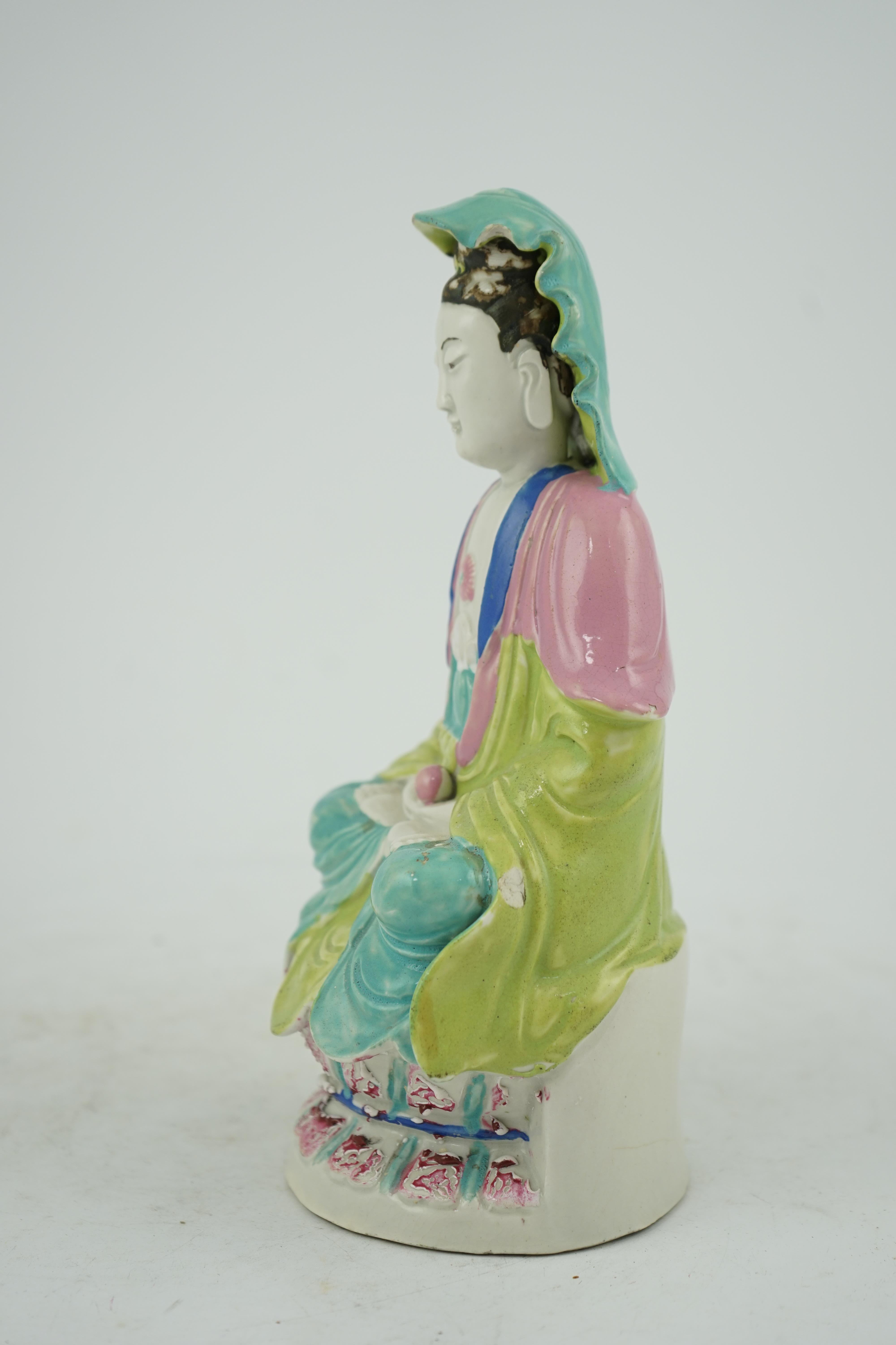 A Chinese Dehua polychrome enamelled blanc de chine figure of Guanyin, late 18th century